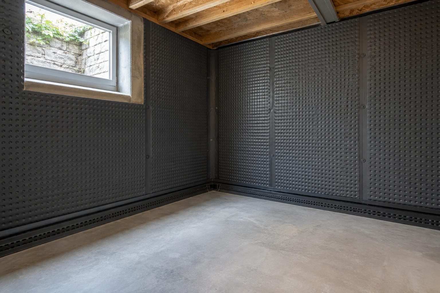 Illustrative basement cavity-drain membrane and perimeter drainage detail
